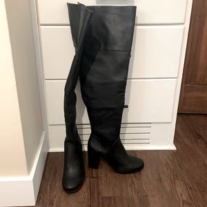 Thigh high black leather boots